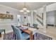 Spacious formal dining room with a chandelier and seating for four at 3 Guilder Cv, Durham, NC 27713