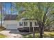 Lovely two-story home featuring a covered porch, a convenient attached garage, and a manicured lawn at 3 Guilder Cv, Durham, NC 27713
