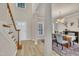 Bright foyer featuring hardwood floors, stairs, and a dining area with chandelier at 3 Guilder Cv, Durham, NC 27713