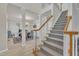An open foyer with stairway to the second floor and view of the dining room at 3 Guilder Cv, Durham, NC 27713