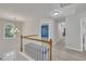 Upstairs hallway featuring an arched window and comfortable sitting bench at 3 Guilder Cv, Durham, NC 27713