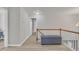 Bright hallway with a tufted ottoman, and view of the stairway at 3 Guilder Cv, Durham, NC 27713