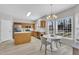 Bright kitchen with stainless steel appliances, a breakfast nook with ample natural light, and a modern chandelier at 3 Guilder Cv, Durham, NC 27713