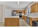 Spacious kitchen featuring stainless steel appliances, center island and wood cabinets at 3 Guilder Cv, Durham, NC 27713