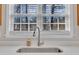 Close up of the kitchen sink featuring modern faucet and bright window views at 3 Guilder Cv, Durham, NC 27713