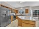 Well-lit kitchen featuring stainless steel appliances and a center island with a white countertop at 3 Guilder Cv, Durham, NC 27713