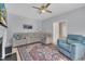 Spacious living room with ceiling fan, stylish furniture, and a decorative rug enhancing the cozy atmosphere at 3 Guilder Cv, Durham, NC 27713