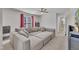 Comfortable living room featuring a large sectional sofa, ceiling fan, and large windows at 3 Guilder Cv, Durham, NC 27713