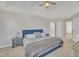 Spacious main bedroom with tray ceilings, ceiling fan, and furniture at 3 Guilder Cv, Durham, NC 27713