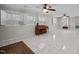 Spacious finished basement features a fireplace, piano, and large windows at 315 Dumont Dr, Hillsborough, NC 27278