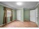 Cozy bedroom with wood floors, green walls, and two windows at 315 Dumont Dr, Hillsborough, NC 27278