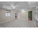Spacious bonus room offers tile flooring, a ceiling fan, and natural light at 315 Dumont Dr, Hillsborough, NC 27278