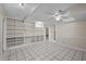 Large bonus room featuring tile floors and built-in shelving at 315 Dumont Dr, Hillsborough, NC 27278