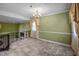 Elegant dining room featuring an ornate chandelier and views into the living room at 315 Dumont Dr, Hillsborough, NC 27278