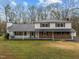 Charming two-story home with a metal roof and inviting front porch at 315 Dumont Dr, Hillsborough, NC 27278