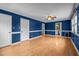 Large living room with laminate floor, two entrances and ceiling fan at 315 Dumont Dr, Hillsborough, NC 27278