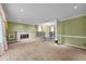 Spacious living room with a cozy fireplace and unique two-level design at 315 Dumont Dr, Hillsborough, NC 27278