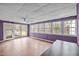 Bright sun room with tile flooring, multiple windows, and a ceiling fan at 315 Dumont Dr, Hillsborough, NC 27278