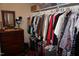 Walk-in closet features wooden chest of drawers and an organized hanging space for clothes at 3516 Apache Dr, Raleigh, NC 27609
