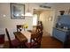 Cozy dining room featuring a wooden table with seating for four and an antique cabinet at 3516 Apache Dr, Raleigh, NC 27609