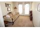 The living room features a comfortable sofa, neutral carpet, and access to the back yard at 3516 Apache Dr, Raleigh, NC 27609