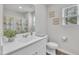 Bathroom featuring a white vanity, decorative shower curtain, and nautical themed wall art at 40 Poplar Bark Dr, Youngsville, NC 27596