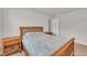 Bedroom featuring a wood bed frame with matching nightstands on neutral carpet at 40 Poplar Bark Dr, Youngsville, NC 27596