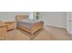 Inviting bedroom boasts a wood bed, a nightstand, and plenty of natural light at 40 Poplar Bark Dr, Youngsville, NC 27596