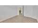 Bedroom has neutral carpet with a white door slightly ajar and a glimpse into another room at 40 Poplar Bark Dr, Youngsville, NC 27596