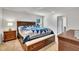Comfortable bedroom with a king size bed, wood furniture and plush carpet flooring at 40 Poplar Bark Dr, Youngsville, NC 27596