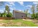 Exterior backyard view of home showcasing a wooden deck and enclosed yard at 40 Poplar Bark Dr, Youngsville, NC 27596