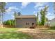 Exterior backyard view of home featuring a wooden deck and fenced yard at 40 Poplar Bark Dr, Youngsville, NC 27596