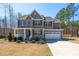 Charming two-story home features a stone accent, large front porch, and a well-maintained yard at 40 Poplar Bark Dr, Youngsville, NC 27596