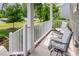 Cozy covered front porch featuring seating and a view of the lush green lawn and surrounding neighborhood at 40 Poplar Bark Dr, Youngsville, NC 27596