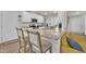 Modern kitchen with stainless steel appliances, granite countertops, and breakfast bar seating for casual dining at 40 Poplar Bark Dr, Youngsville, NC 27596