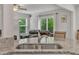 Open-concept kitchen with granite countertops, stainless steel sink, and view into the living area at 40 Poplar Bark Dr, Youngsville, NC 27596