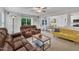 Open concept living area featuring comfortable seating, connecting kitchen, and natural light at 40 Poplar Bark Dr, Youngsville, NC 27596