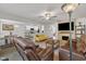 Inviting living room with open floor plan, connecting kitchen, and comfortable seating arrangements at 40 Poplar Bark Dr, Youngsville, NC 27596