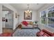 Comfortable living room featuring ample seating, a decorative rug, and lots of light at 40 Poplar Bark Dr, Youngsville, NC 27596