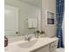 Well-lit bathroom with a sleek vanity, ample countertop space, and attractive decor for a modern feel at 404 Deercroft Dr, Apex, NC 27539