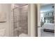Modern bathroom features a glass-enclosed shower and an open doorway into the main bedroom at 404 Deercroft Dr, Apex, NC 27539