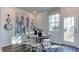 Bright dining area with a round table, white chairs, and access to the outdoor deck at 404 Deercroft Dr, Apex, NC 27539