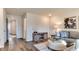 Open-concept living area with modern furnishings, decor, and ample natural light, perfect for relaxation at 404 Deercroft Dr, Apex, NC 27539