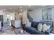 Open-concept living room and kitchen layout with modern furnishings at 404 Deercroft Dr, Apex, NC 27539