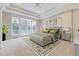 Primary bedroom with tray ceiling and a large window offers a peaceful and private retreat at 404 Vintage Hill Cir, Apex, NC 27539