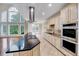 Modern kitchen featuring granite countertops and stainless steel appliances at 404 Vintage Hill Cir, Apex, NC 27539
