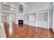 Open living room featuring high ceilings, built-in shelving, and a cozy fireplace at 404 Vintage Hill Cir, Apex, NC 27539