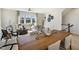 Bright living room with contemporary decor, large window and adjacent dining area, great for entertaining at 408 Rowe Way, Knightdale, NC 27545