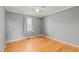 Comfortable bedroom with hardwood floors, neutral walls, and window for natural light at 41 Rock Bluff Ln, Kittrell, NC 27544