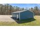 Detached metal garage with ample space for storage and projects at 41 Rock Bluff Ln, Kittrell, NC 27544